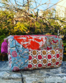 Handcrafted patch work toilet pouch made from vibrant patchwork fabric